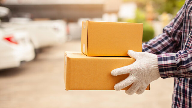 Parcel delivery service with white gloves Online shopping concept and fast delivery service.