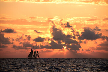 Sailboat sailing in the Mediterranean Sea at sunset