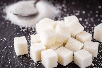 sugar refined on a dark stone background