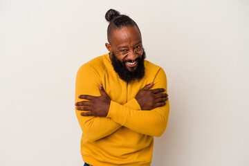 African american man with beard isolated on pink background laughing and having fun.