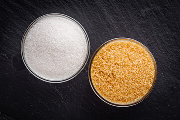 cane brown sugar on a dark stone background