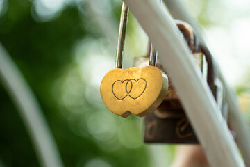 Golden wedding lock with two hearts on it.Symbol of love.
