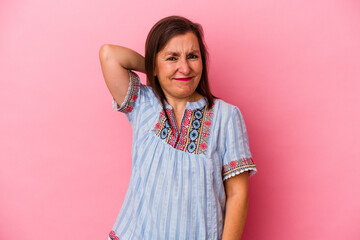 Fototapeta premium Middle age caucasian woman isolated on pink background suffering neck pain due to sedentary lifestyle.