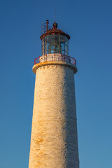 Close up view of the tower and the beacon of the Cap des Rosiers lighthouse, the highest in Canada, located near Forillon National Park n Quebec