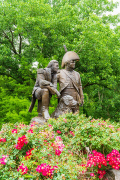 St Charles, MO - June 8, 2021: Artist Pat Kennedy created this bronze monument of explorers Captain Meriwether Lewis (right), Captain William Clark (left), and Lewis’ Newfoundland Dog “Seaman”.