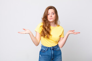 pretty red head woman feeling puzzled and confused and doubting
