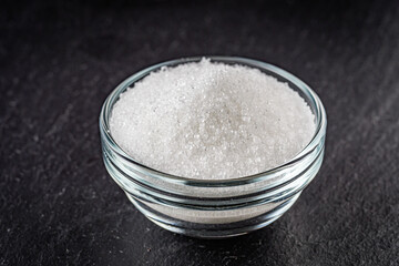citric acid on a dark stone background