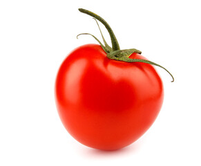The ripe red tomato is isolated on a white background. Full clipping path.