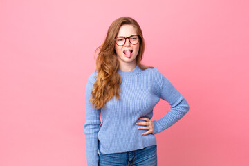 pretty red head woman feeling disgusted and irritated and tongue out