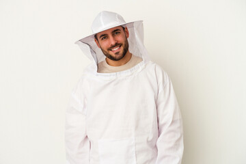Young apiculture caucasian man isolated on white background happy, smiling and cheerful.