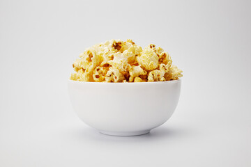 popcorn in white plate isolate on white background