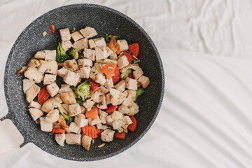 Homemade Stir fried chicken with mixed vegetables.