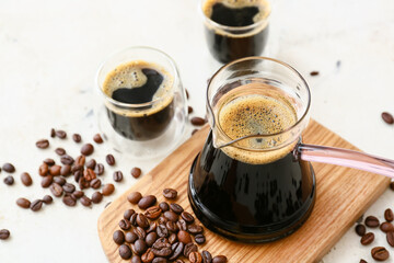 Composition with aromatic turkish coffee and beans on light background, closeup