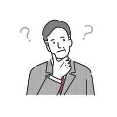 顎に手をあてて考えるミドルシニアのビジネスマン