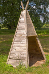 a wooden teepee made with wooden planks © Frank