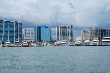 Skyline on Bayfront with Docked Yachts in Harbor Under Cloudy Sky
