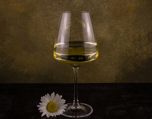 a glass of white wine and chamomile