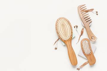 Hair brushes and comb on color background - obrazy, fototapety, plakaty