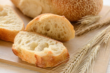 Slices of fresh bread on board
