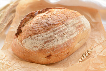 Loaf of sourdough bread on parchment
