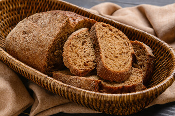 Basket with wholegrain bread on napkin
