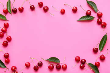 Frame made of tasty ripe cherry on color background
