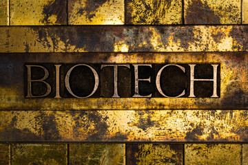 Biotech text on grunge textured copper and gold background