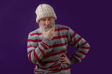 Adult handsome senior male model wearing striped sweater showing