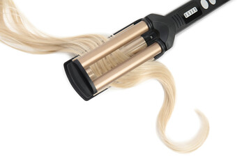 Modern triple curling iron with blonde hair lock on white background, top view