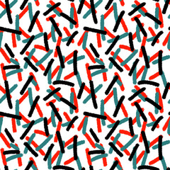 abstract seamless pattern of red, green and black brush strokes on a white background.