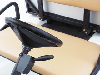 The steering wheel with the lever and the seat of a buggy car. Closeup photos