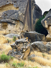 Gobustan national park ancient rocks, rock path and mountains near Baku in Azerbaijan. Exposition of Petroglyphs in Gobustan near Baku, Azerbaijan.