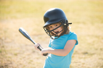 Fototapeta na wymiar Funny boy kid holding a baseball bat. Pitcher child about to throw in youth baseball.