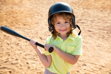 Fototapeta na wymiar Child baseball player focused ready to bat. Kid holding a baseball bat.
