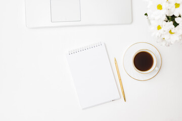 Mockup white notebook, laptop, cup of coffee on a white background
