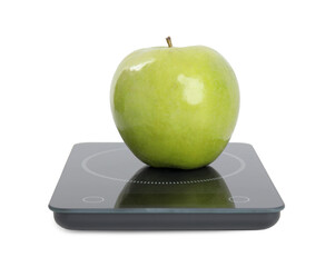 Ripe green apple and electronic scales on white background
