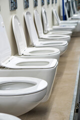 Lot of white toilets in hardware store, plumbing department