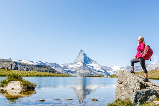 woman looking at the beautiful Mount Matterhorn in the Swiss Alps