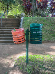 trash bins at a public park separated by organic and recyclable trash