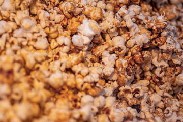homemade caramel sweet popcorn as a detailed close-up shot, selective focus.