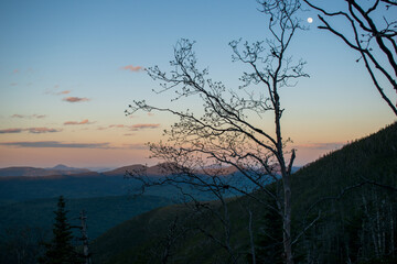Sunsetting over the mountains with moon