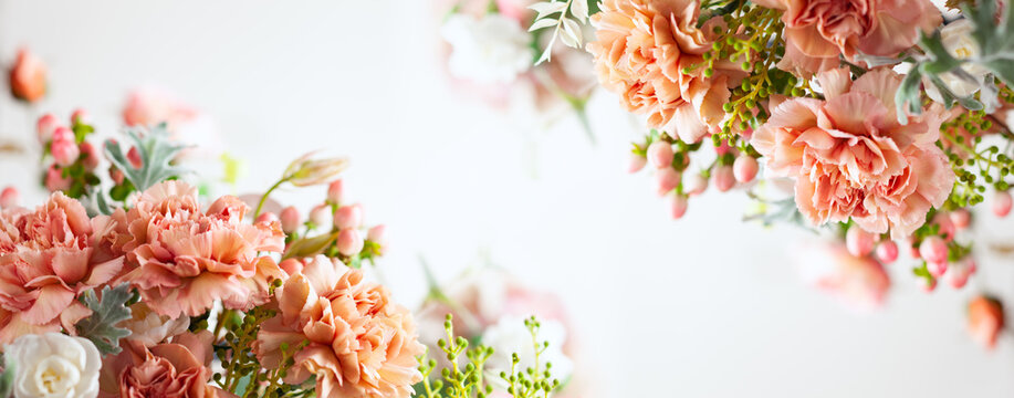 Autumn composition made of beautiful flowers on light backdrop. Floristic decoration. Natural floral background.