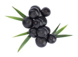 Pile of fresh ripe acai berries and green leaves on white background, top view