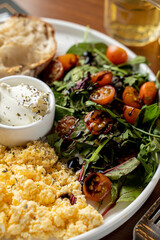 Scrambled eggs with sausage, close appetizing photo for a hotel menu