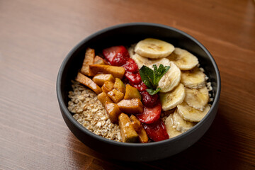 Top view of healthy breakfast with whole grain vegetarian oatmeal