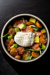 Salmon salad with a poached egg in a restaurant