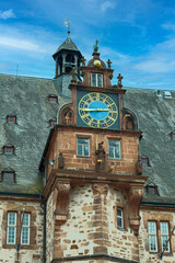 beautiful old tower clock on the town hall of the small German town of Marburg