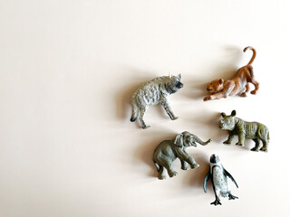 Figures of animals on a white background Children's toys: rhino, hippopotamus, zebra. The concept of children's play, montessori. many pieces to play. A gift for a child. Animal protection.