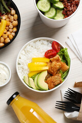 Flat lay composition with healthy takeaway food on white wooden table