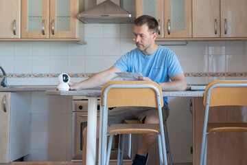 Man reading the instructions for installing a security camera